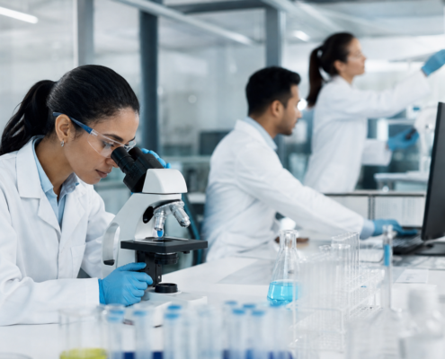 diverse scientists working in a modern lab, demonstrating the biotechnology talent pipeline.