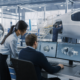 two aerospace engineers discussing cad designs on monitors for aerospace engineering talent recruitment.